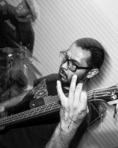 black and white photo of the bass player of Last Remorse
