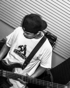 black and white photo of the bass player of Suicide Revolver