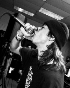 black and white photo of the singer of Suicide Revolver