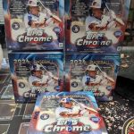 This image depicts five boxes of Topps Chrome 2024 baseball trading cards, still sealed in shrink wrap marked with the Topps logo.
